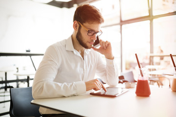 Busy businessman working in restaurant