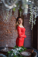 Girl in red dress enthralling