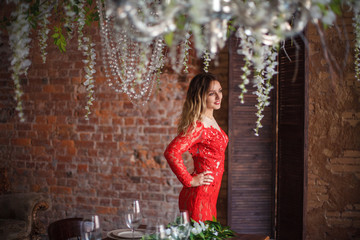 Girl in red dress enthralling