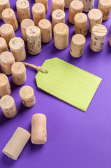 Wine cork stoppers with green label on purple background.Useful