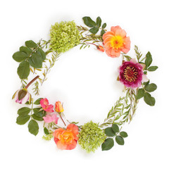 Floral round crown (wreath) with flowers and leaves. Flat lay