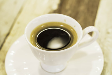 Cup of coffee on a wooden table