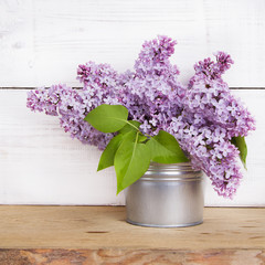 lilac flowers on white wooden background
