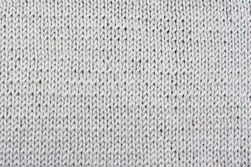 Background gray textured draperies. Knitted pattern