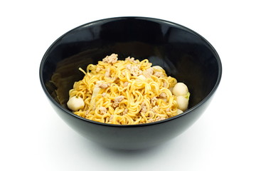 Yellow instant noodle in black bowl on white background