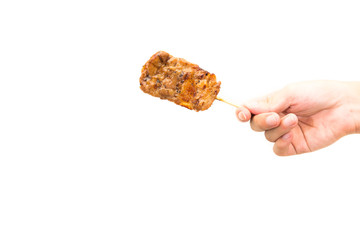 Hand hold grilled pork on white background