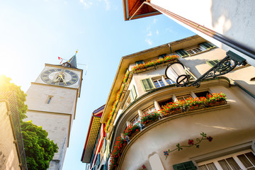 Beautiful old building and church tower in the old town of Zurich city in Switzerland. Vew from below