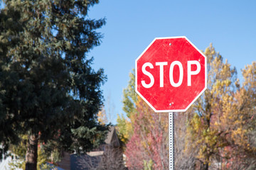 Stop sign in a Colorado neighborhood in the autumn