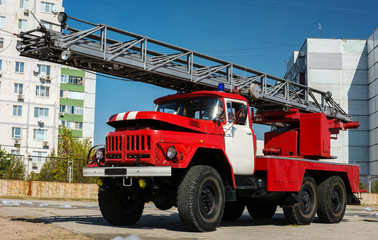  red fire truck with a ladder.
