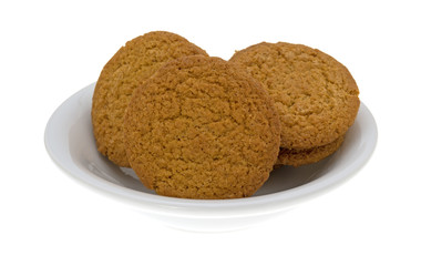 Cheesecake filled pumpkin cookies in a bowl isolated on a white background.