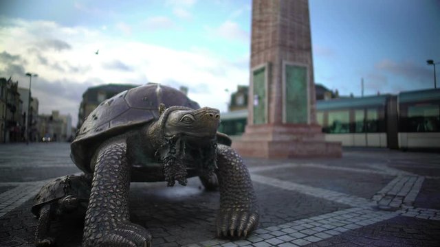 Bronze sculpture of turtle standing on Place de la Victorie in Bordeaux, France