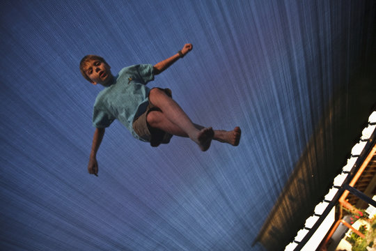 Low Angle Of Boy On Trampoline; Ferndale, Washington, United States of America
