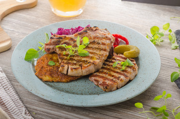 Grilled pork chops with herbs and garlic, potato pancakes