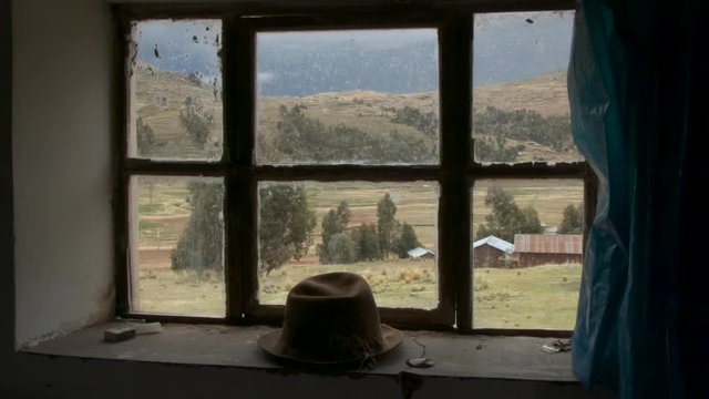 Rural Peru scene, sliding shot, looking out a window into Juliaca, Peru.