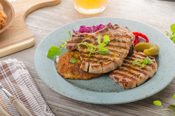Grilled pork chops with herbs and garlic, potato pancakes