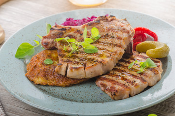 Grilled pork chops with herbs and garlic, potato pancakes