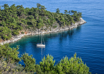 Yacht anchored in the blue waters of a bay