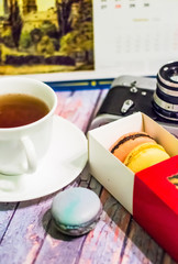 Still life with macaron on wooden background