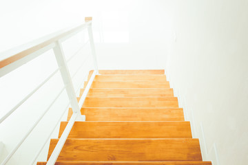 The modern wooden stair way in home close up.(Processed in vintage colour tone)