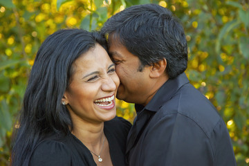 Happy couple enjoying together in a park