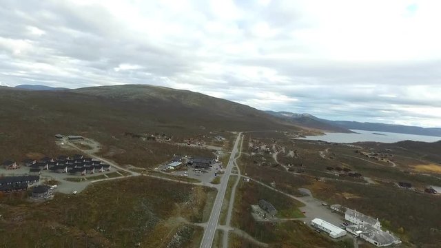 Aerial view on kilpisjarvi town mountains surrounding it, on a cloudy day, in Kilpisjärvi, Lapland, Finland