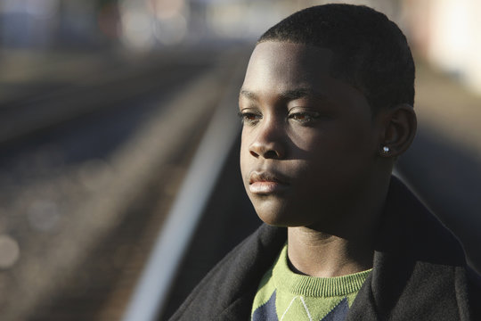 Portrait Of Teenage Boy By Train Tracks; Portland, Oregon, United States of America