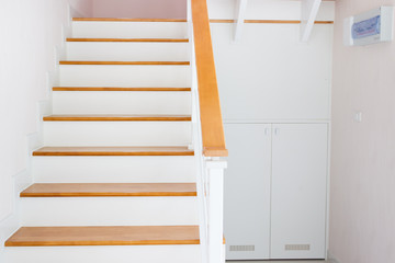 The modern wooden stair way in home close up.