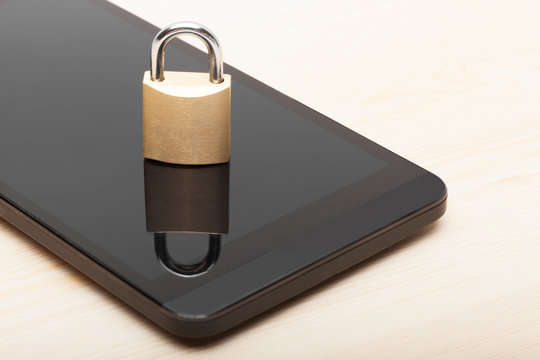 Smartphone with small lock. Mobile phone security and data protection concept