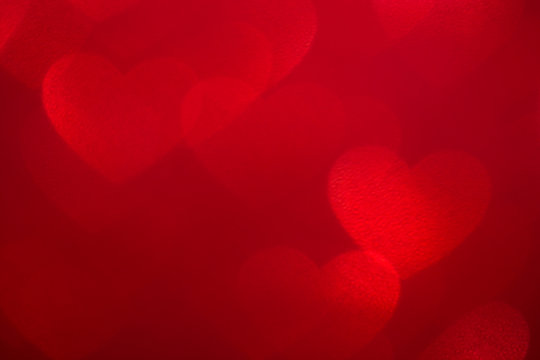 De-focused red big hearts grunge abstract background. Valentine's day