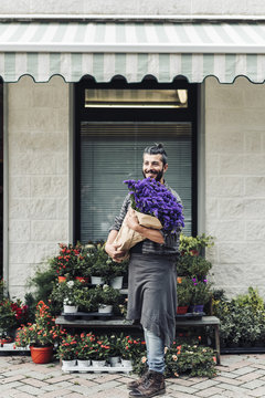 male florist working in flower shop