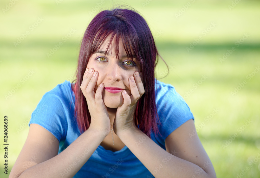 Wall mural portrait of a young woman with green eyes