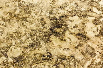 Dirty grunge yellow stained paper pattern background.