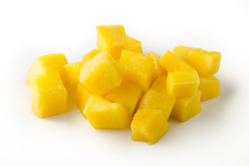 Mango slice cut to cubes isolated on white background