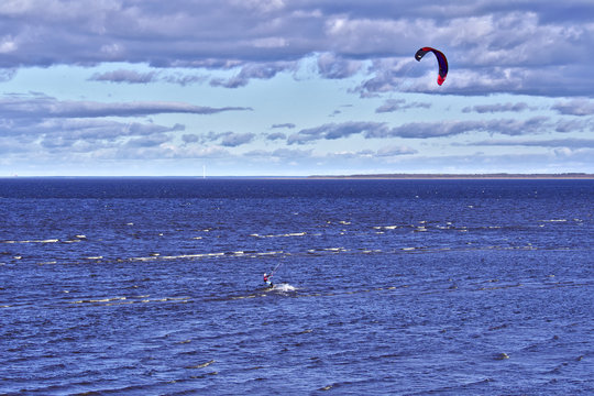 Lone kite surfer at the sea.