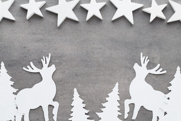 Christmas background. White tree decorations on a gray backgroun