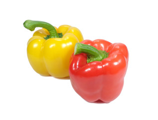 Closed up two ripe bright color bell peppers, one red and one yellow with green stem isolated on white background 