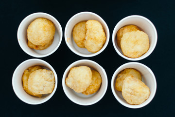 Chicken nuggets in paper cups. The view from the top.