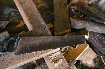 saw with sawdust and pieces of wood.