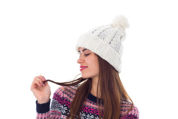 Woman in sweater and white hat