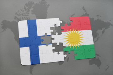 puzzle with the national flag of finland and kurdistan on a world map background.