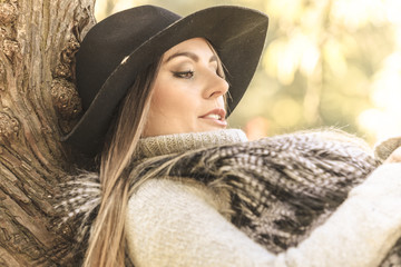 Beautiful autumnal woman in park