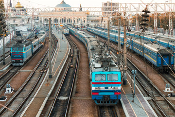 old trains on ukrainian railways. Railway station on background.People are waiting on platform - Odessa railway station © Igor Kardasov