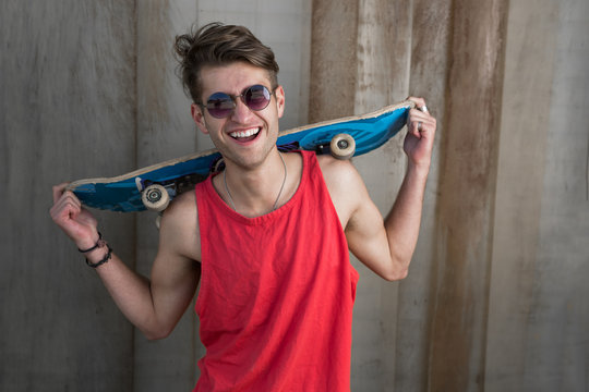 fashionable guy with skateboard