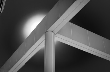 Abstract building structure. Building cross beams and pillar structure. Architectural detail of building structure. Industrial art design and detail. Minimal architecture design. Black and white. 