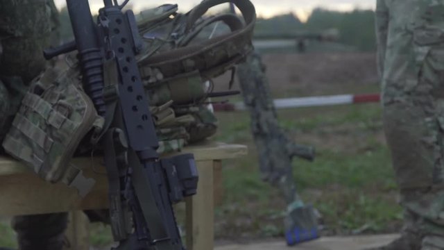 Military uniforms in small arms. Rifle and machine gun