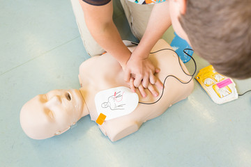 First aid cardiopulmonary resuscitation course using automated external defibrillator device, AED.