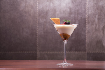 tiramisu in glass cup with dark background