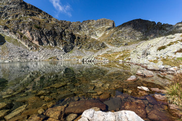Stones in the water of Elenski lakes and Malyovitsa peak, Rila Mountain, Bulgaria