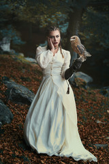 Young woman and her little barn owl