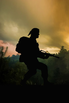 Silhouette of American special forces soldier on patrol in the jungle of Vietnam. (Artist illustration)